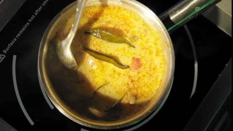 Stirring a pot of vegetable soup close up Stock Footage 170233007