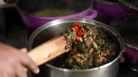 Stirring a pot of vegetable soup Stock-Footage 257343191