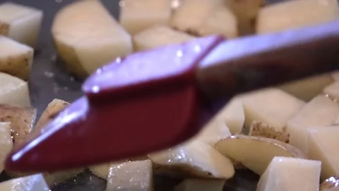 Stirring Potatoes on Frying Pan Video stock 77024829