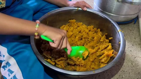 Stirring the pumpkin fruit cake batter Stock Footage 329492450