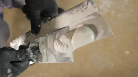 Stirring of putty. Putty knife. Preparation for work. Stock Footage 88474155