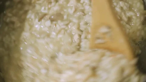 Stirring risotto in pan during cooking Vidéo 82543240