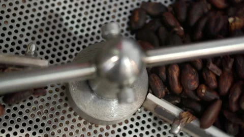 Stirring roasted coffee beans close-up. Stock Footage 166563452