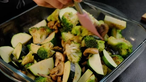 Stirring Roasted Vegetables and Apples in Baking Dish, Cooking Stock Footage 341427903