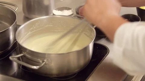 Stirring sauce in pot Stock Footage 77048961