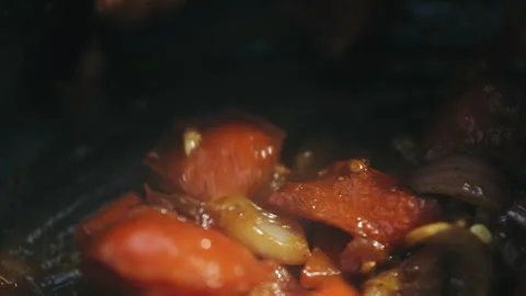 Stirring saucy vegetables in a pot Stock Footage 274683712