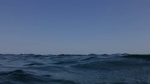 Stirring on the sea surface captured on the water level. Stock Footage 83736261