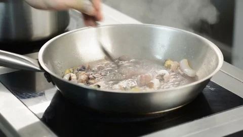 Stirring seafood in pan, close up Stock Footage 73132266