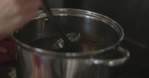 Stirring soup with a ladle Video stock 76413359