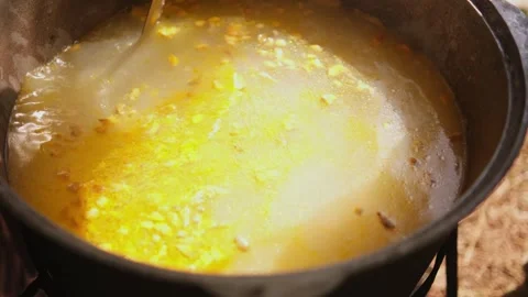 Stirring the soup in a large pot Stock Footage 309952332