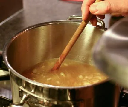 Stirring soup Stock Photos