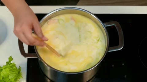 Stirring soup in a saucepan Video stock 78483460