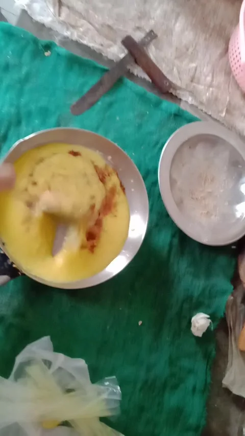 Stirring Spices and Masala with a Spoon into Cooked Lentils for Perfect Fry Stock Footage 341451432