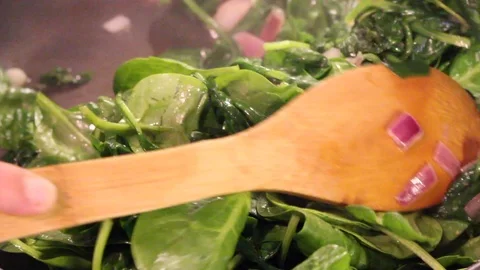 Stirring spinach closeup Stock Footage 96475759