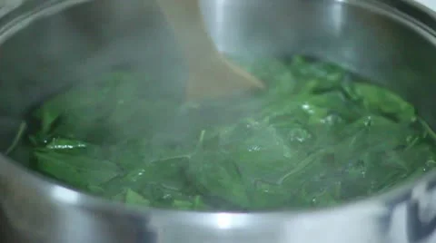 Stirring spinach Stock Footage 8995620