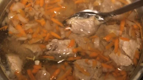 Stirring spoon broth with meat.close-up Stock Footage 72124999