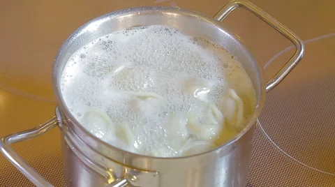 Stirring spoon dumplings in the pan Stock Footage 59757952