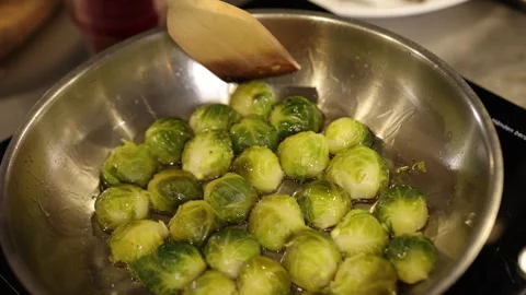 Stirring spoon, kitchen setting, cooking veggies Stock Footage 311987618