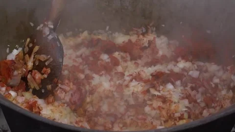 Stirring steaming food in a cauldron. Stock Footage 285955726