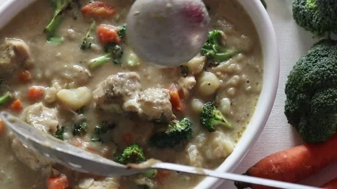 Stirring the stewed chicken with vegetables Stock-Footage 237181842