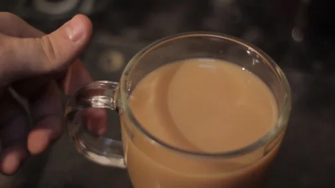 Stirring Tea and Picking Up The Cup Stock Footage 85992814