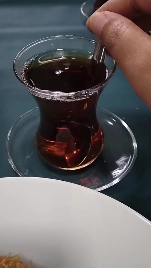 Stirring Traditional Turkish Tea at Table Stock Footage 295167768