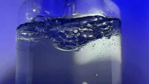 Stirring water, blue light Stock Footage 257481573
