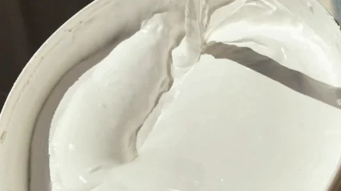 Stirring white color paint Stock Footage 103786672