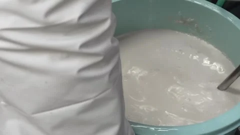 Stirring White Starch Batter in a Blue Mixing Bowl Stock Footage 340009434