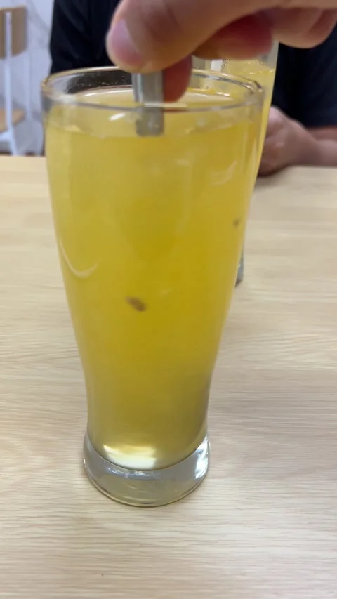 Stirring Yellow Beverage with Spoon Video stock 311354025