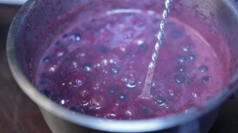 Stirs boiling jam Stock Footage 96992482
