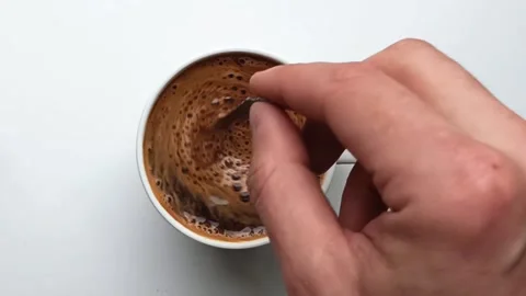 Stirs coffee in a mug Stock Footage 194339237