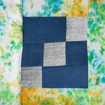 Stitched patchwork fabric with floral pattern Stock Photos