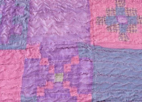 Stitched pieces of silk fabric in patchwork scarf textile background - sti... Stock Photos