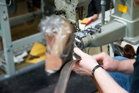 Stitching a belt Stock Photos