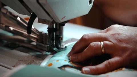 Stitching the edging on oven mitts Stock Footage 135269776