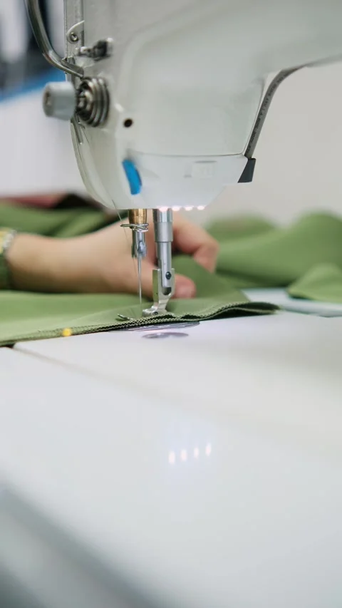 Stitching fabric on a sewing machine Stock Footage 309951008