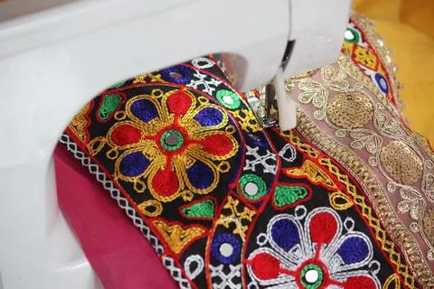 Stitching machine closeup for sewing navratri laces for chaniya choli Stock Photos