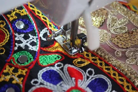 Stitching machine closeup for sewing navratri laces for chaniya choli Stock Photos