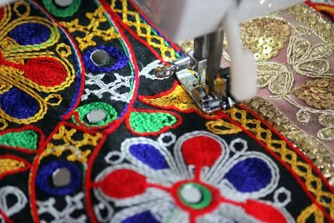 Stitching machine closeup for sewing navratri laces for chaniya choli Stock Photos