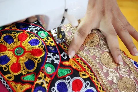 Stitching machine closeup for sewing navratri laces for chaniya choli Stock Photos
