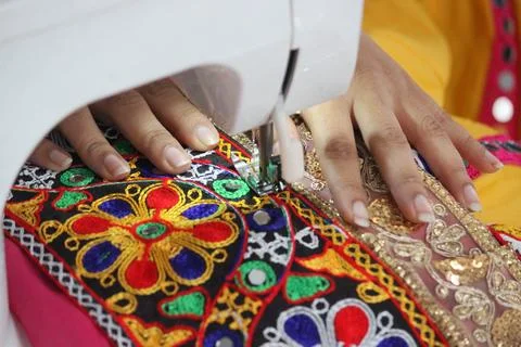 Stitching machine closeup for sewing navratri laces for chaniya choli Stock Photos
