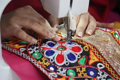 Stitching machine closeup for sewing navratri laces for chaniya choli Stock Photos