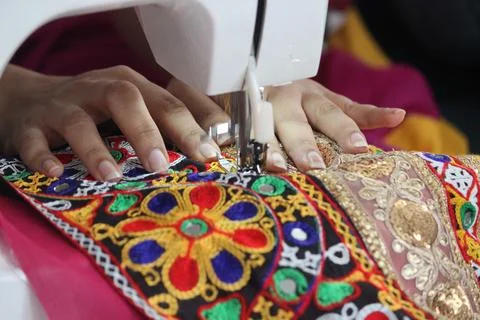 Stitching machine closeup for sewing navratri laces for chaniya choli Stock Photos