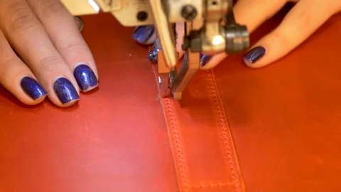 Stitching red leather with sewing machine Stock Footage 118135356