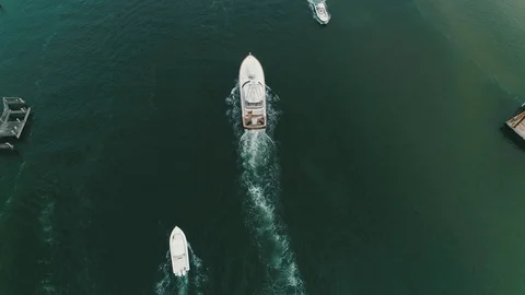 Stock of arial above a boat leaving inlet Stock Footage 104264671