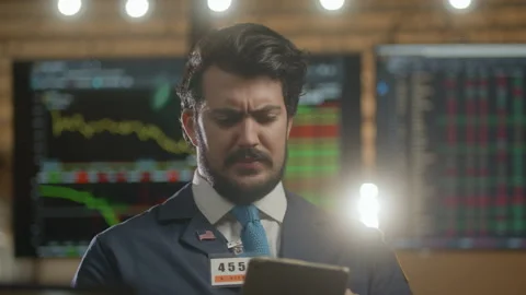 Stock broker on the floor upset when the market turns for the worse Stock Footage 233742178