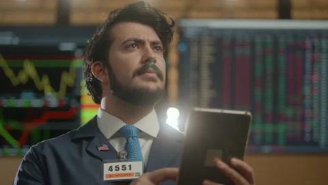 Stock broker on the trading floor checking the market Stock Footage 233754574