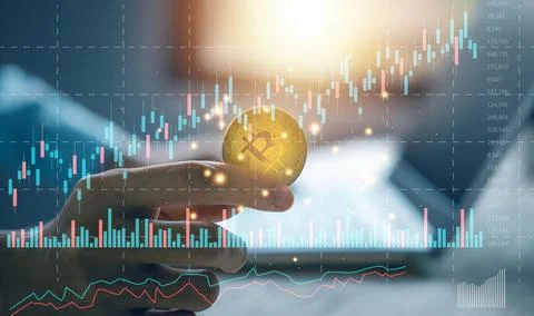 Stock chart or cryptocurrency chart with businessman hand hold bitcoin note.. Stock Photos