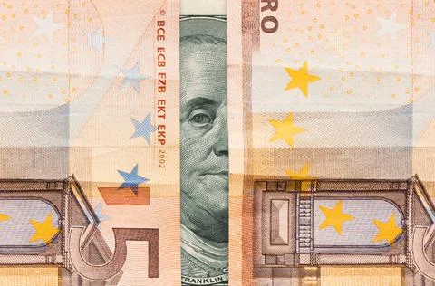 Stock exchange. Dollar and euro banknotes, close-up. Benjamin Franklin's sigh Stock Photos